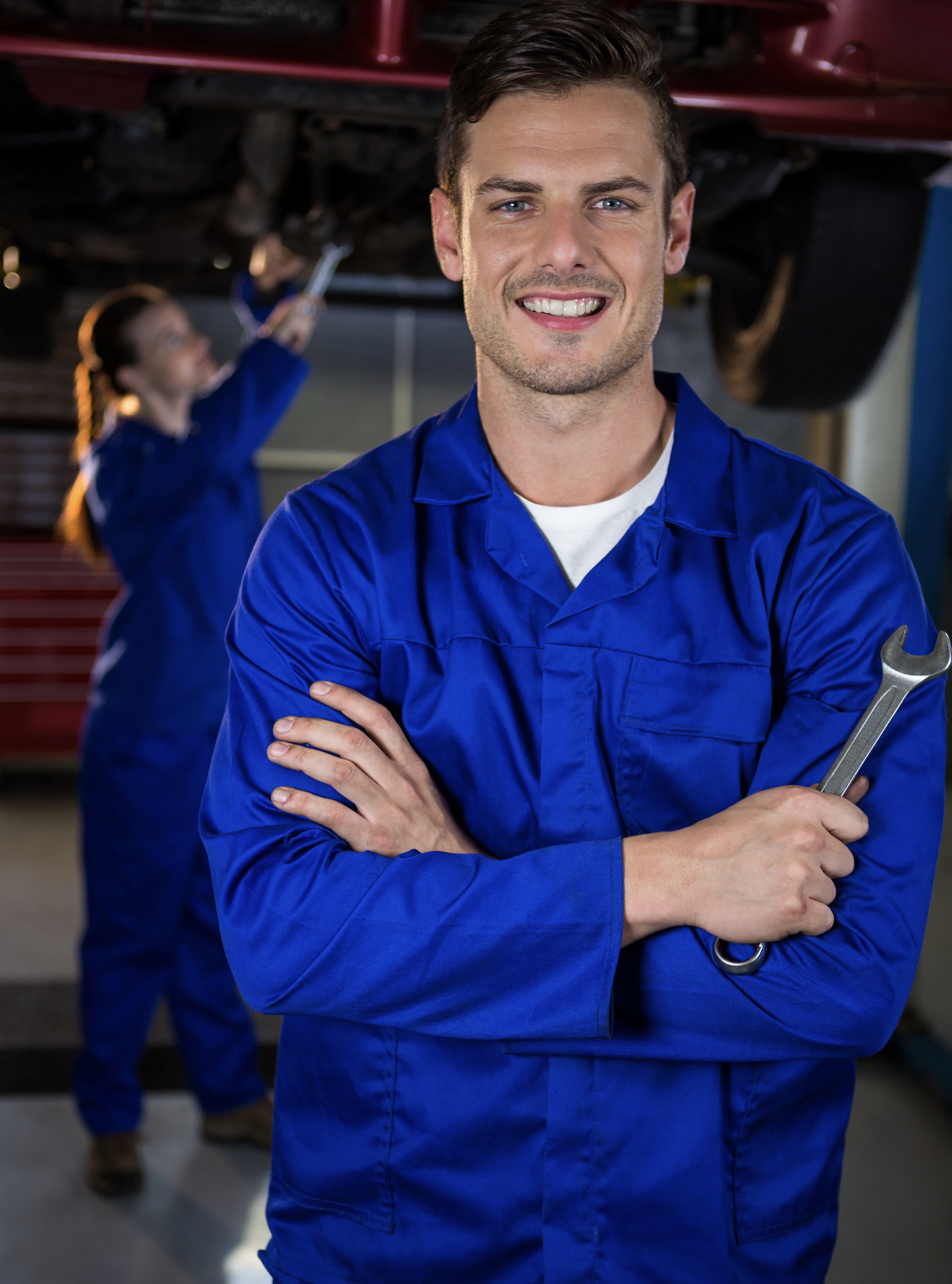 mechanic standing-at-repair-garage